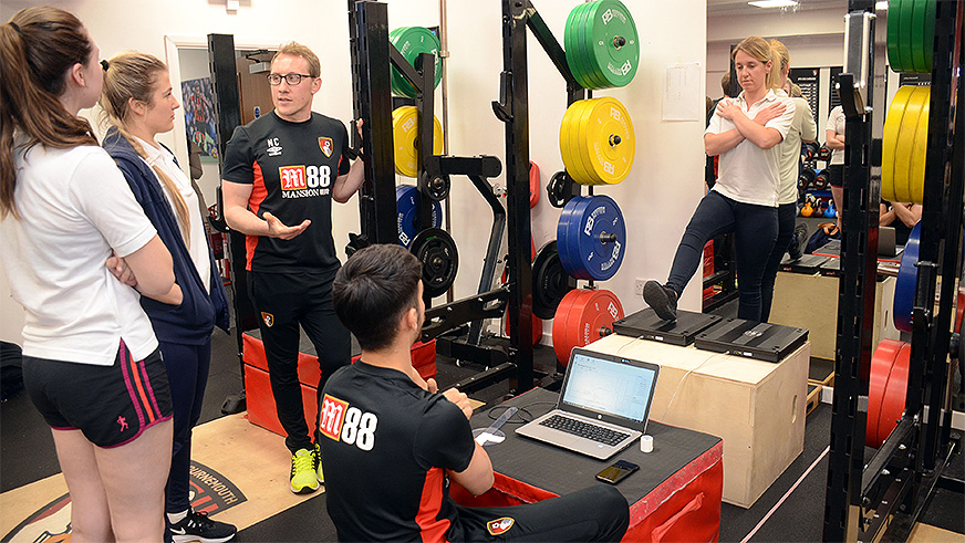 BU physiotherapy students and AFC Bournemouth physiotherapists working together in the gym. Our students have regular access to the club's physio team, putting their learning into practice