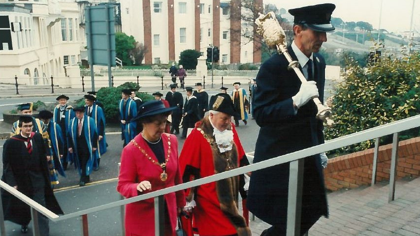 The ceremonial party walking into the BIC, with the ceremonial mace being carried