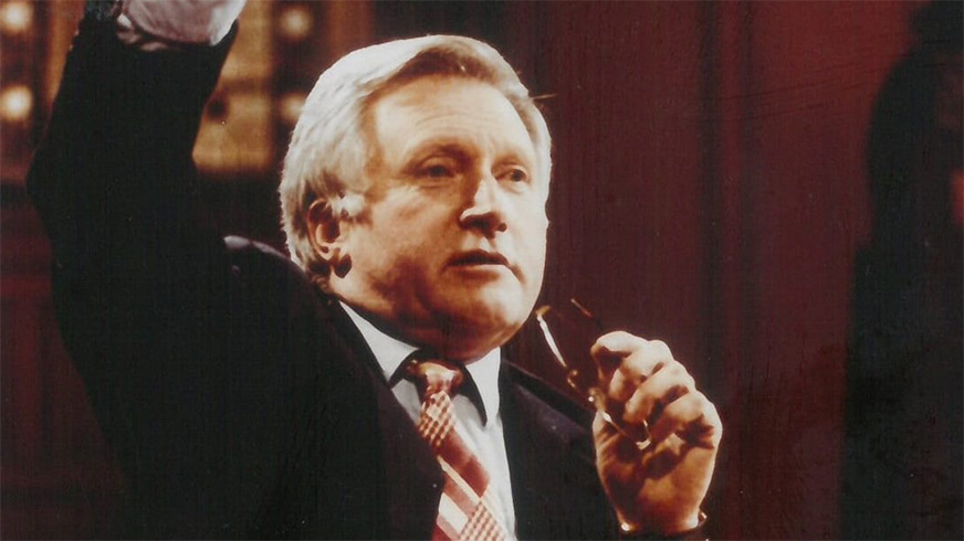 A headshot of Question Time host, David Dimbleby. He presented the popular show from 1994-2018 and since retiring has presented occasional BBC documentaries