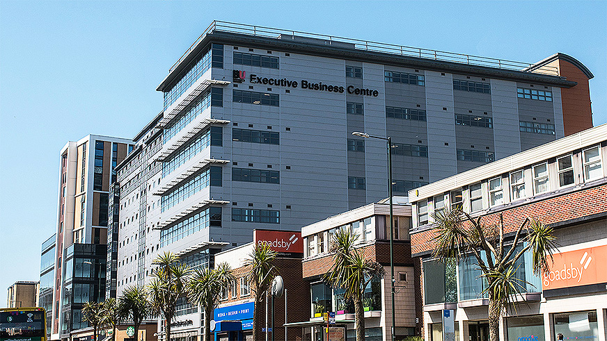 The exterior of the Executive Business Centre on Holdenhurst Road in Bournemouth. Inside, it's a modern, light-filled building with lots of formal and informal spaces