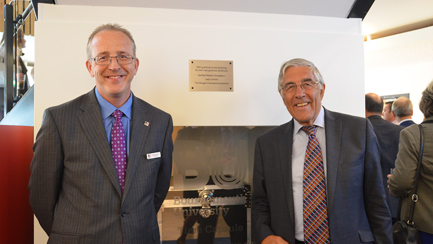 Professor John Vinney, BU's Vice-Chancellor, and Lord Nicholas Phillips, then Chancellor, standing either side of the time capsule in The Student Centre