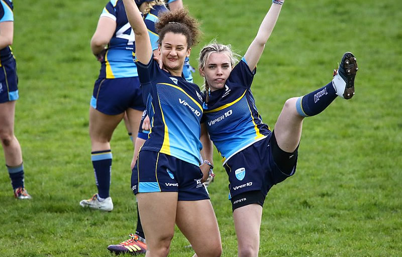 Two female students celebrating