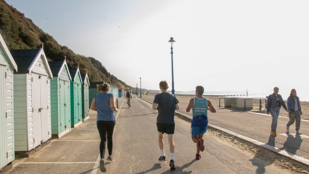 Image of people doing a run at Bournemouth Beach