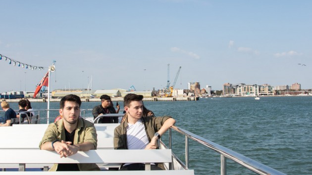Image of two students on a boat trip