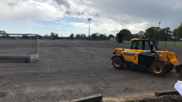Digger on hockey pitch at Chapel Gate