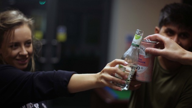 Image of students making a toast with drinks