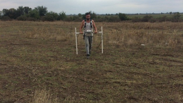 Dr Derek Pitman surveying at the site