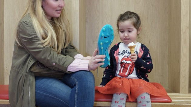 Elisa and Elvira Bolat examine boots