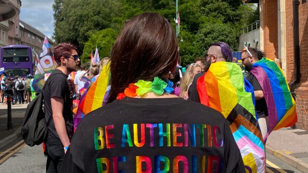 A BU staff member wearing a t-shirt that says 'Be authentic, Be proud, Be you' at the Bourne Free 2024 annual Pride event in Bournemouth
