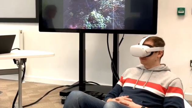 A Learning Technologist wearing a VR headset