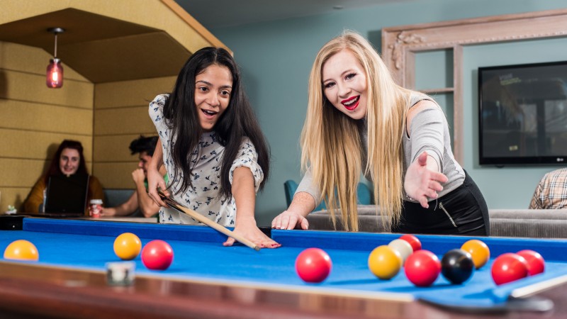 Students playing pool in halls