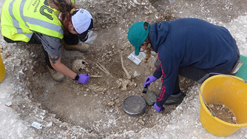 Students excavating human remains
