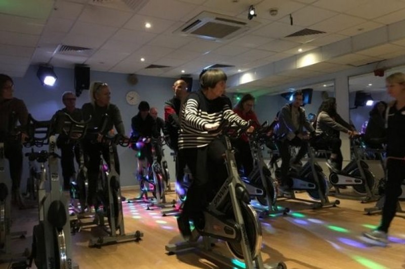 People using exercise bikes