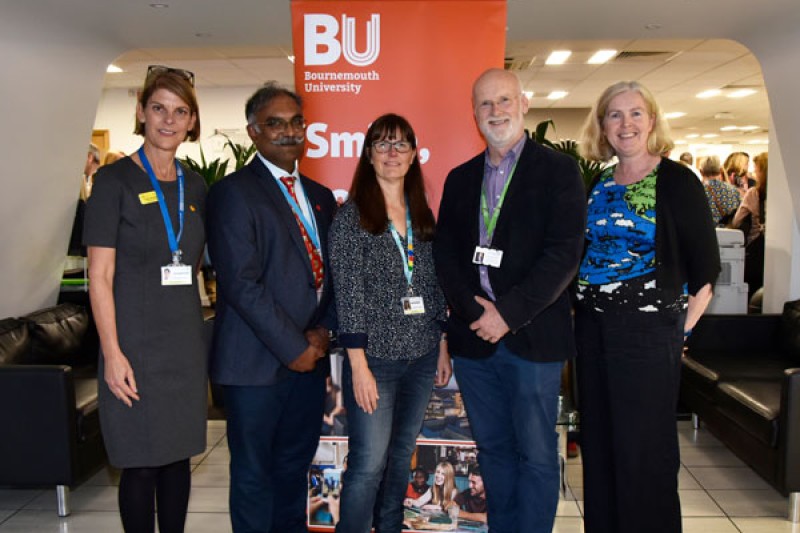 BU and UHD colleagues standing in the foyer of the Executive Business Centre