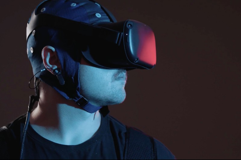 A man looking to one side in a virtual reality headset