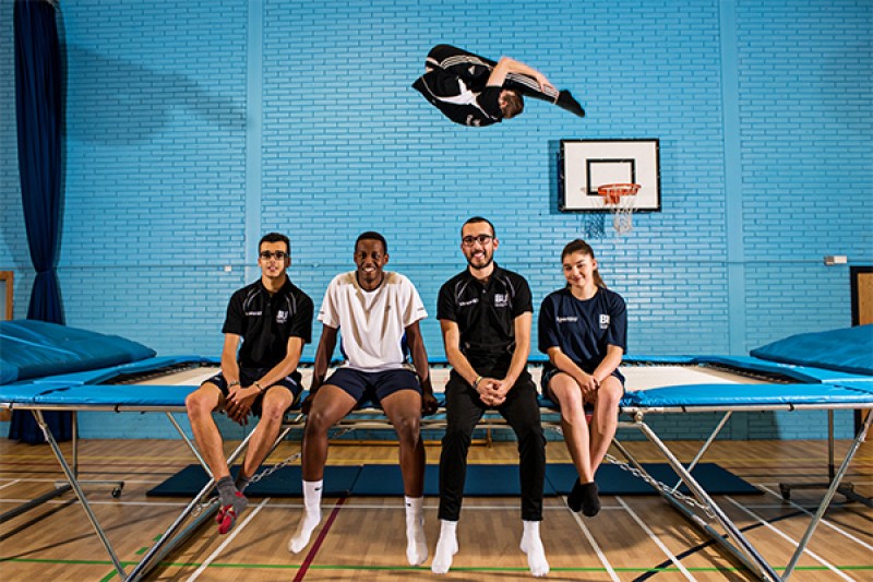 Image of people sitting on trampoline