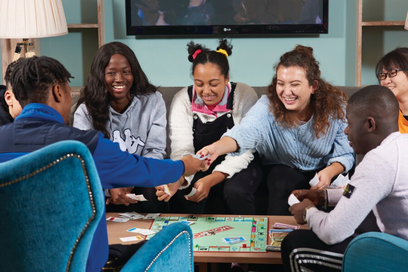 BU students playing Monopoly in a communal area of halls of residence