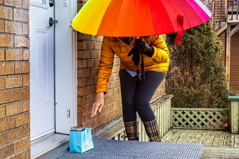 Carer dropping off food parcel