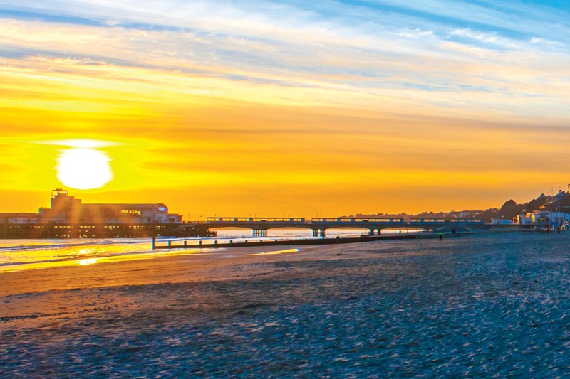 Alumni of the year 2022 image of Bournemouth Beach at sunset