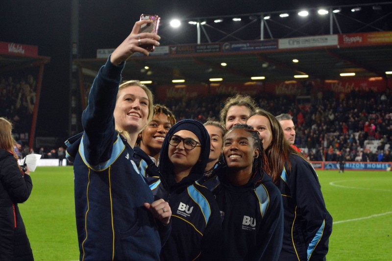 A group of Bournemouth University female students taking a selfie at a BU Big Match