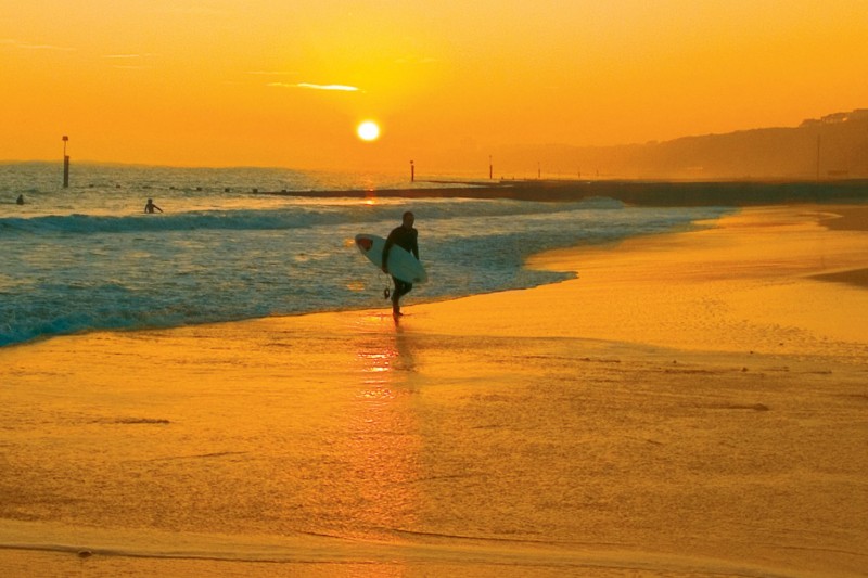 Bournemouth beach sunset surfer