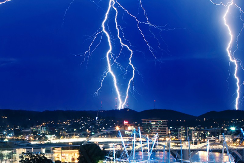 Lightning over a city at night