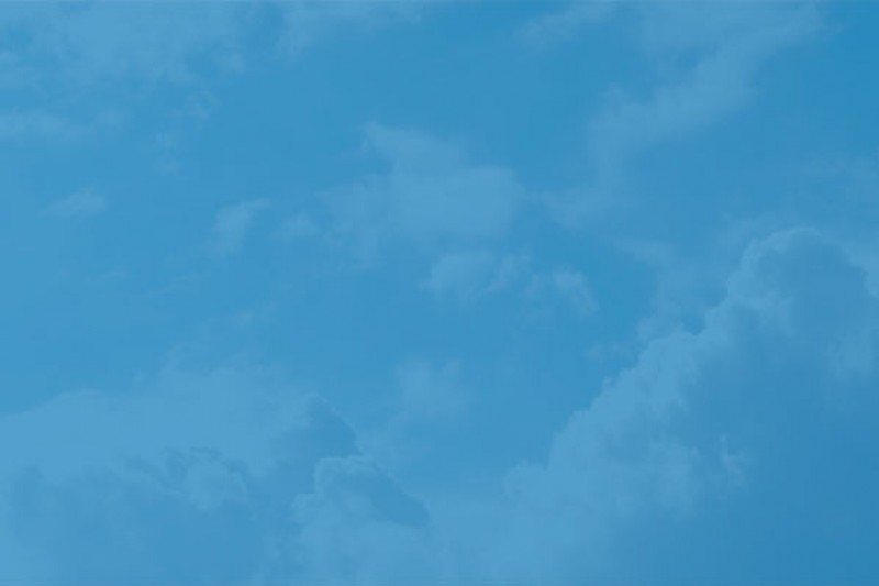 Clouds behind a blue background