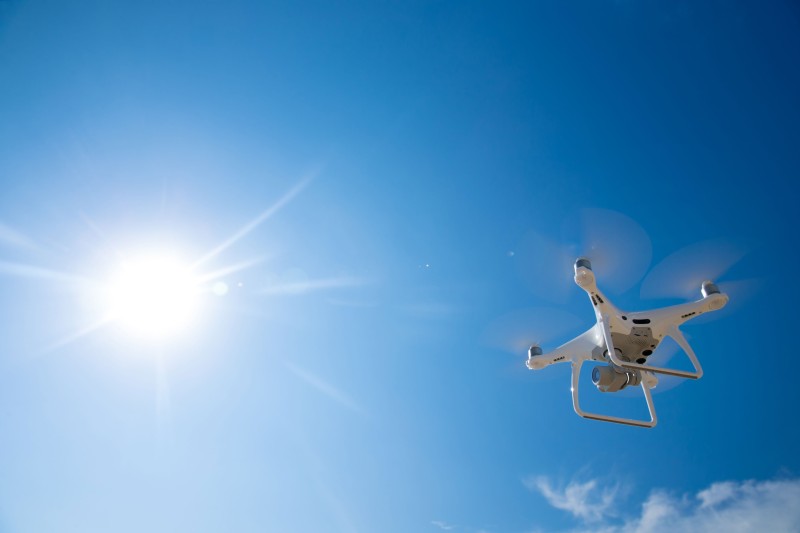 A drone device flying through the sky