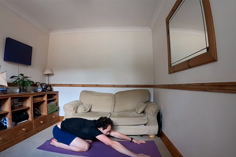 A man exercising in his home