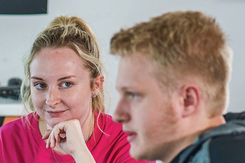 Four students discussing a problem