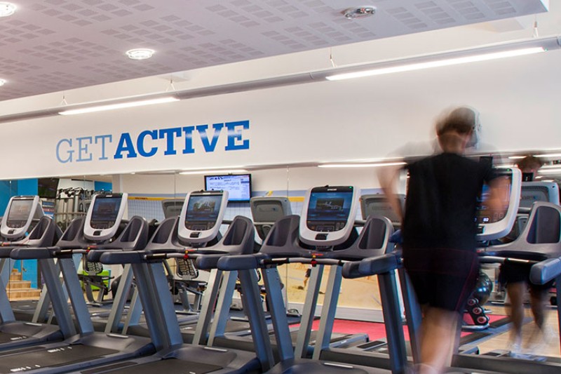 A picture of the SportBU gym, including treadmills, exercise bikes and weights