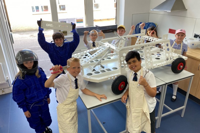 Pupils from St Peter's School work on an electric car 