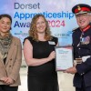Abigail holding a certificate at the awards ceremony