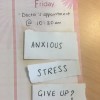 A calendar with a note of a doctor's appointment and the words 'anxious', 'stress' and 'give up?'