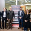 A group of people stood next to a pull-up banner for The Net - AFC Bournemouth's free business club