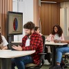 Two groups of people sitting at a table