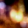Image of a camera lens against blurred lights