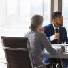 Busy millennial professional group reviewing startup marketing reports