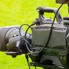 Image of a film camera against a green backdrop