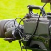 Image of a film camera against a green backdrop