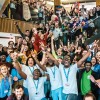 A large group of students and staff in the Student Centre