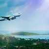 An aeroplane flying over a tropical landscape 