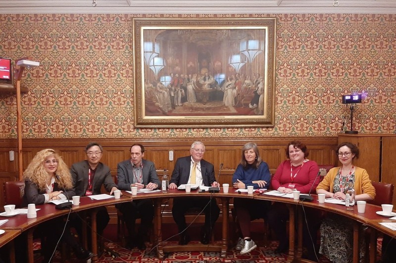 BU researchers sat around a table in the House of Lords BU researchers sat around a table in the House of Lords