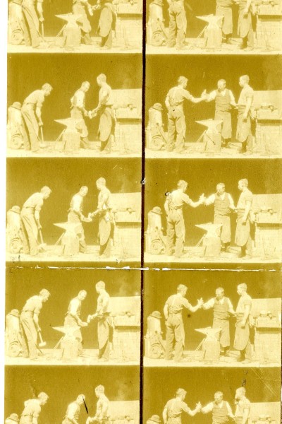 18 frame images, in two columns of nine black and white pictures, showing three men in blacksmiths clothing standing around an anvil