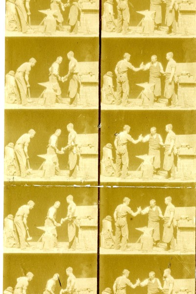 18 frame images, in two columns of nine black and white pictures, showing three men in blacksmiths clothing standing around an anvil