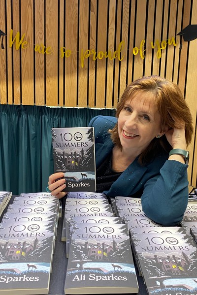 Ali Sparkes holding up her new book Ali Sparkes holding up her new book