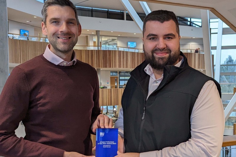 Jonathan Goode, head of Alumni relations, and David holding the Alumni Volunteer of the Year plaque