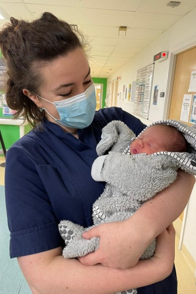 Anna Marsh holding a baby 