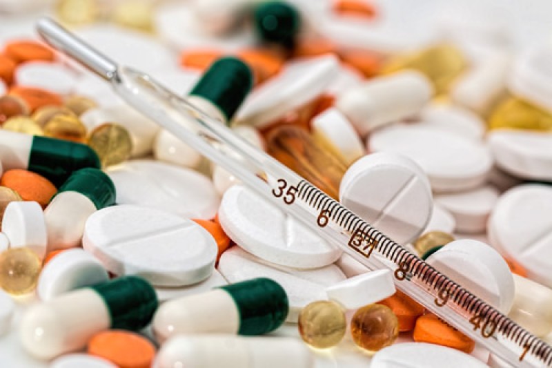 A collection of different tablets scattered on a table