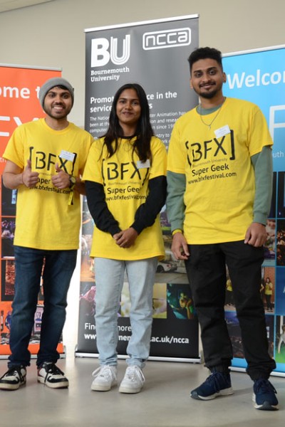 BFX Volunteers standing in front of BFX banners